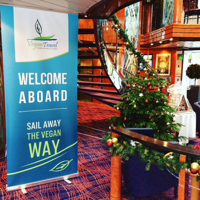 vegan cruises Vegan Travel banner in river ship lobby