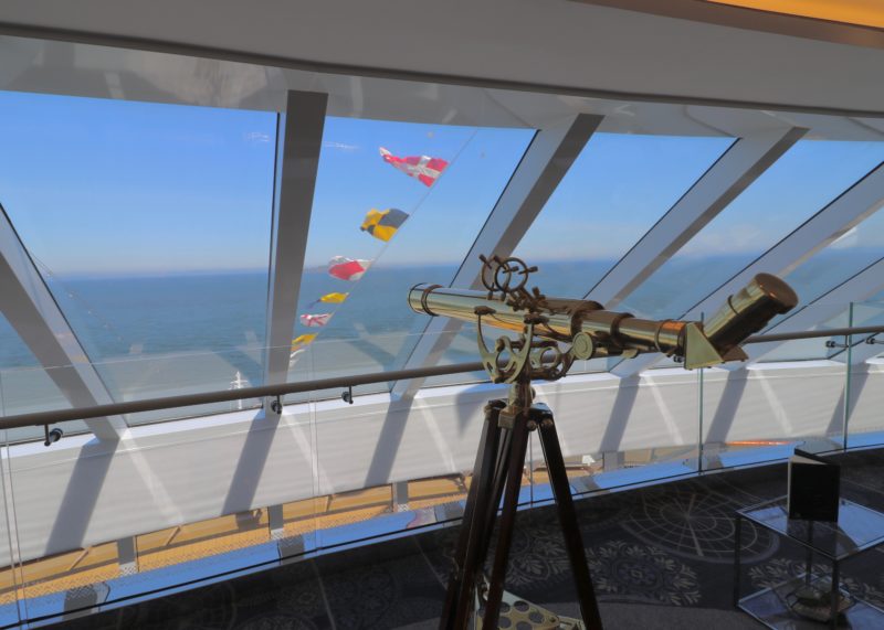 view out of Explorer's Lounge top level with ship flags on view