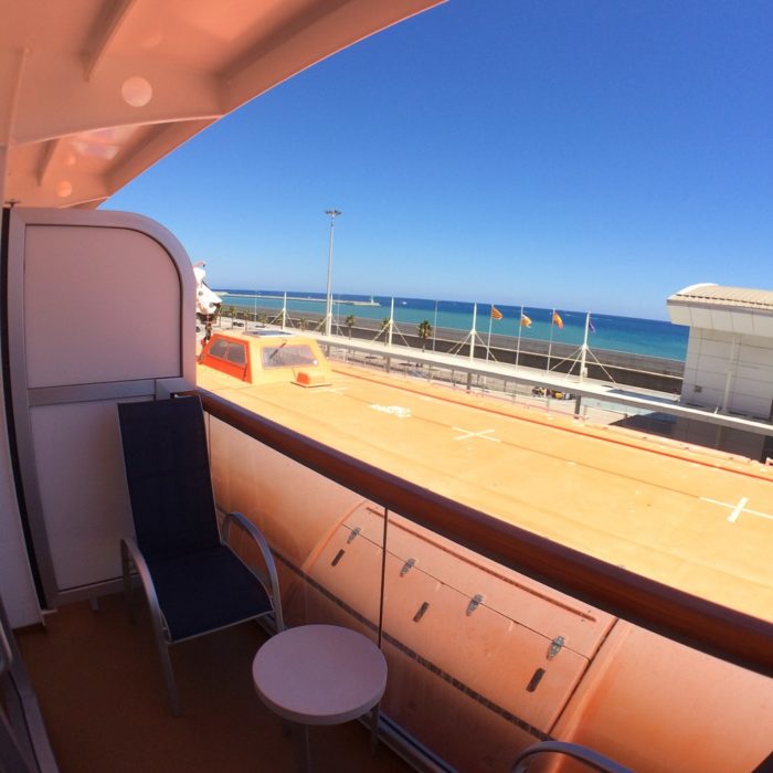 obstructed balcony view on Royal Princess with top of lifeboat at knee height